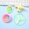 Wholesale of flying saucer gyroscope toys, flying disc sets, nostalgic toys, outdoor flying celestial bamboo dragonfly small toys Application Scenario
